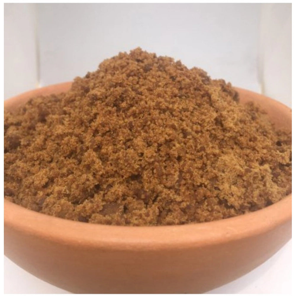 Brown sugar powder in a wooden bowl, fine granular texture