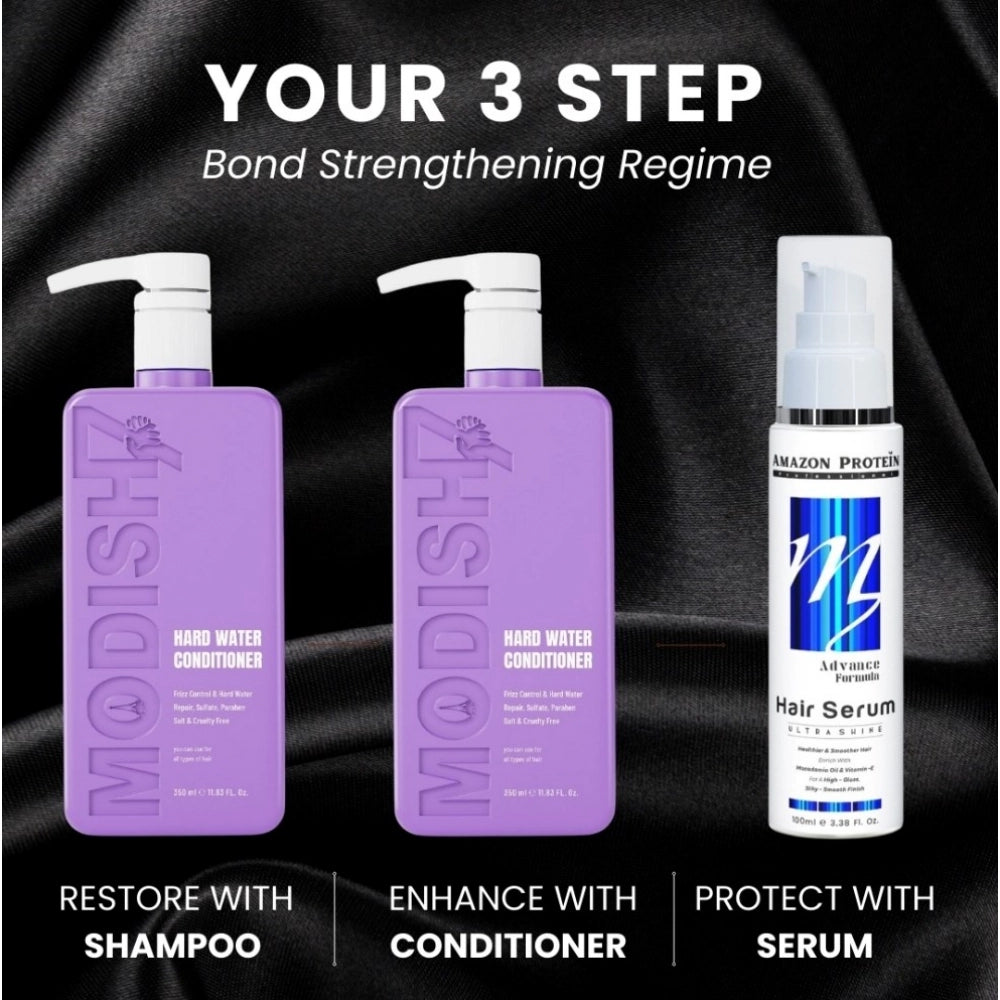Hard water conditioner bottles: two purple pump bottles plus white hair serum bottle