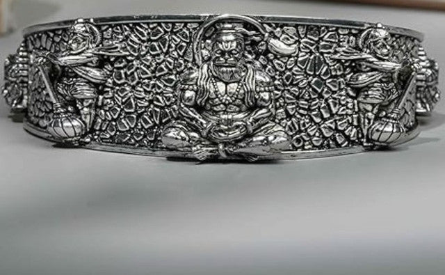 Silver-tone Hanumanji cuff bangle with detailed raised deity figure and textured surface