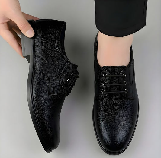 Men's black lace-up formal shoes with textured finish and low-profile sole