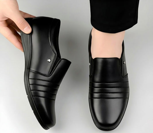 Black synthetic leather slip-on formal shoe with stitched side stripes and pull-on tab